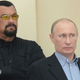 Steven Seagal, Vladimir Putin, and their fire down below. (Photo by Dmitry Azarov / Kommersant via Getty Images)